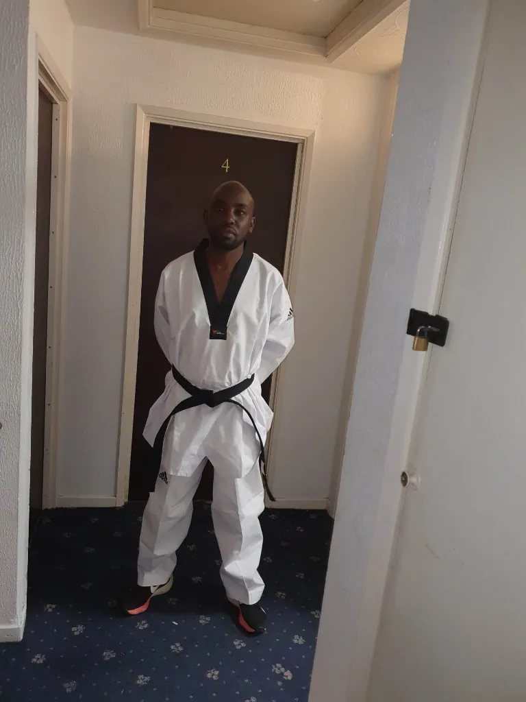 Black-belt athlete in a taekwondo uniform