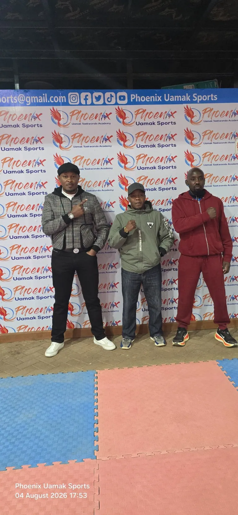 Coaches at a Phoenix Uamak Sports event backdrop
